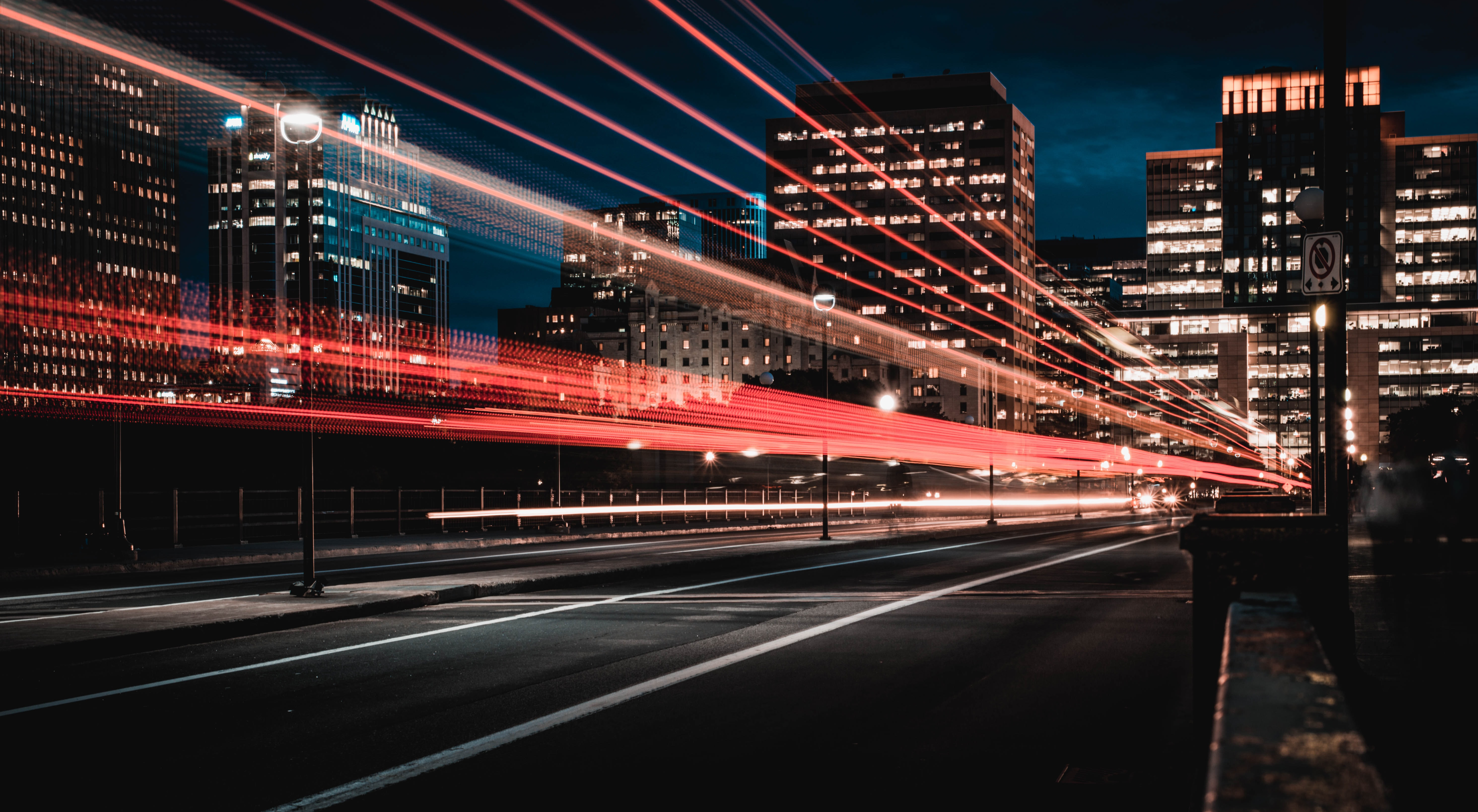 Stop Lights in Motion on a City Street at Night